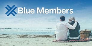 Advertising banner for Extra Blue members with a couple on a beach 